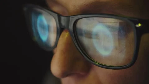 In the reflection of glasses on a female face, there is an Internet search Stock Footage 269144292