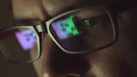 The reflection at the glasses of man: looking a site (side view) Stock Footage 64711436