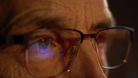 Reflection in glasses of TV news Stock Footage 144830962