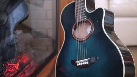 The reflection of the guitar in the fireplace 2 Stock Footage 71955815