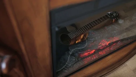 The reflection of the guitar in the fireplace Stock Footage 71956023