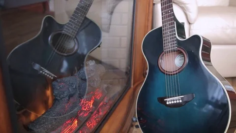 The reflection of the guitar in the fireplace. Stock Footage 71956448
