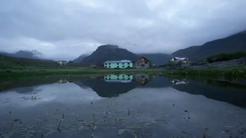Reflection of house with tiger hills in backdrop, Drass, India Stock Footage 320627315