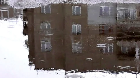 The reflection of the houses in the puddle. The rain Stock Footage 49238453