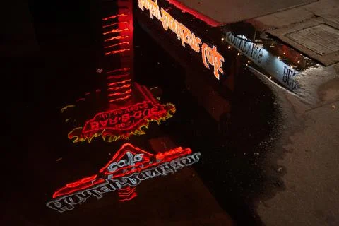 Reflection of an illuminated sign in a puddle in Las Vegas Stock Photos