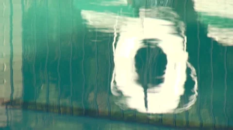 Reflection of inflatable tube in swimming pool Stock Footage 54592922