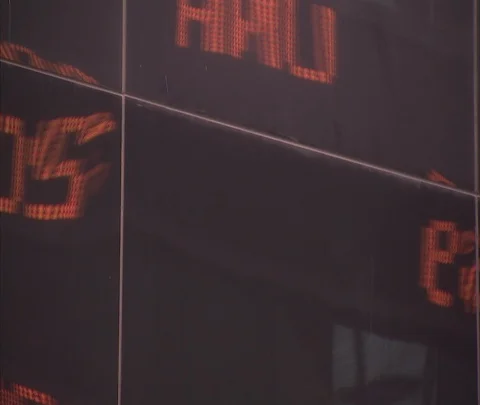 Reflection of information passing on Morgan Stanley LED ticker, zoom out Stock Footage 86749058