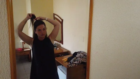 Reflection of lady applying her make-up. Brunette mature woman putting lipstick 스톡 동영상 112223322