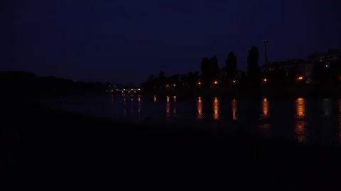 Reflection of lanterns on river on the night near city Stock Footage 91184441