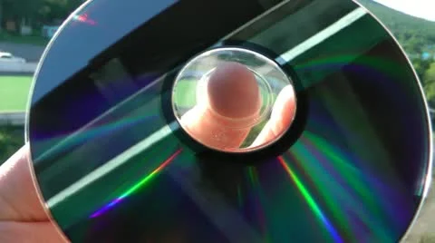 Reflection in the laser disk DVD of the street, the sky and a balcony Stock-Footage 11818120
