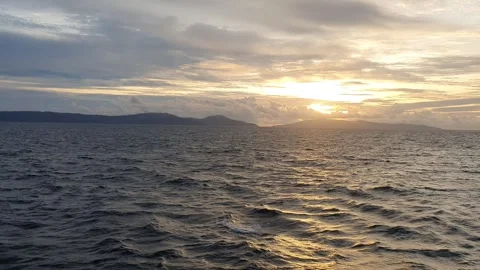 Reflection of light between the choppy sea and cloudy sky Stock Footage 297792287