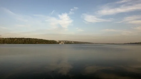 Reflection of light clouds in lake water Video stock 119102212