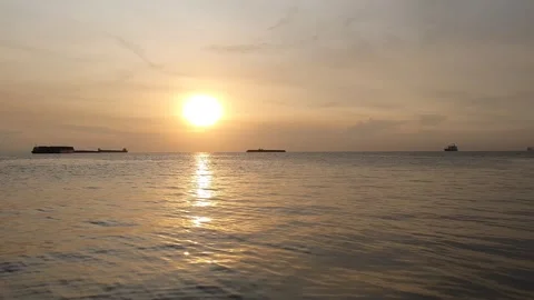 Reflection of light in the ocean with a background of clouds in the sky Stock Footage 297328427