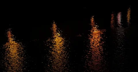 Reflection of light on the river at night - reflexo da luz no rio a anoite Stock Footage 79697039