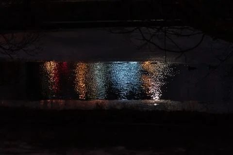Reflection of light on the water, from a lantern at night Stock Photos