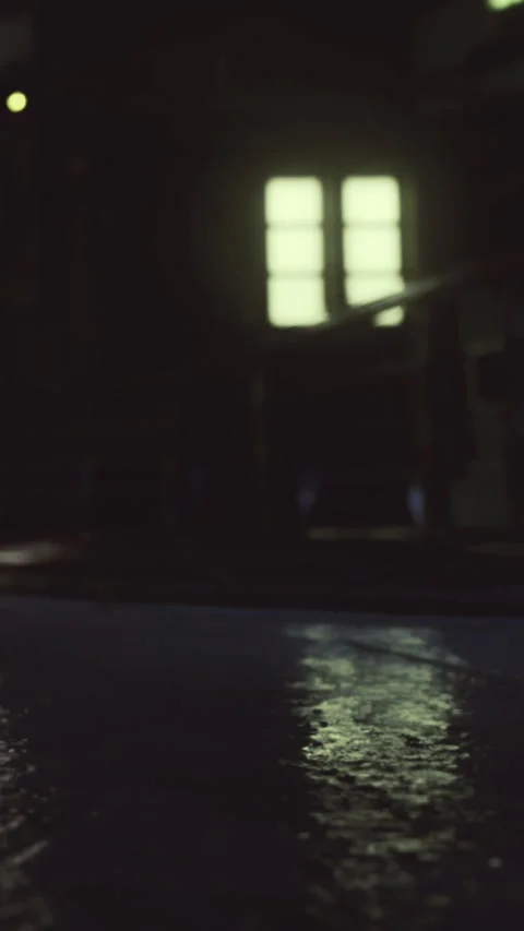 Reflection of light on wet floor in a dimly lit room with windows Stock Footage 336184803