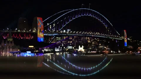Reflection of lights and illumination of Sydney Harbour bridge at night 4k. Stock Footage 221949304