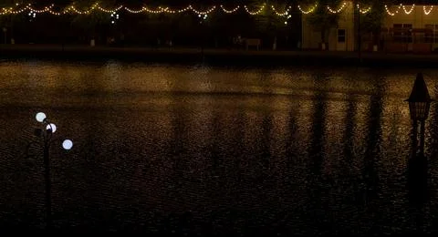 The reflection of lights in the night on the river Photos