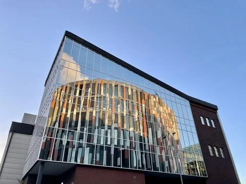 Reflection of the Main Point Karlin office building in the glass facade of the Stock Photos