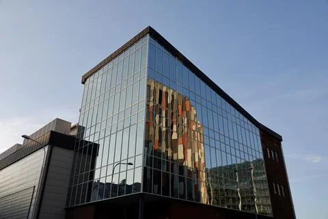Reflection of the Main Point Karlin office building in the glass facade of the Stock Photos
