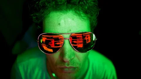 Reflection of malicious code in hacker's sunglasses. Stock Footage 116904196