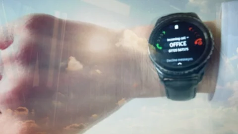 Reflection of a man answering a phone call on a smartwatch Video stock 88426956