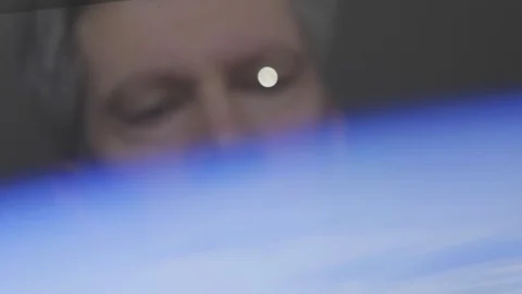 Reflection of a man looking at the moon setting Video stock 102590548