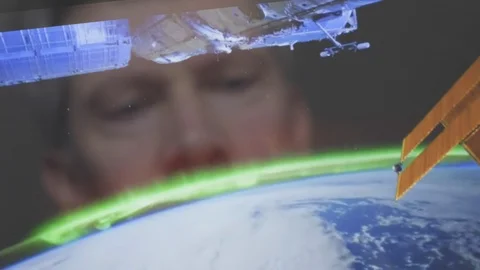 Reflection of a man looking at a view of the earth from space Video stock 102590972