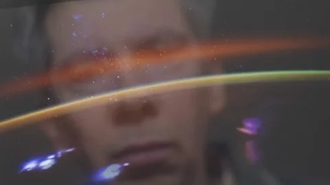 Reflection of a man looking at a view of the earth from space Video stock 102593401