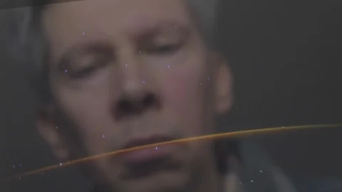 Reflection of a man looking at a view of the earth from space Video stock 102594527