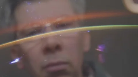 Reflection of a man looking at a view of the earth from space Video stock 102595451