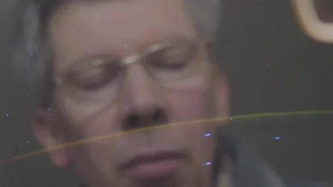 Reflection of a man looking at a view of the earth from space Video stock 102596437