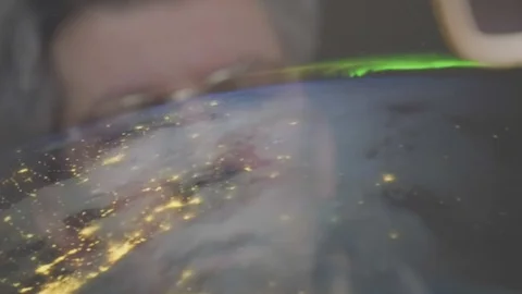 Reflection of a man looking at a view of the earth from space Video stock 102599218