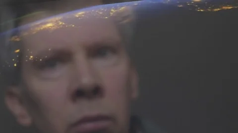 Reflection of a man looking at a view of the earth from space Video stock 102603746