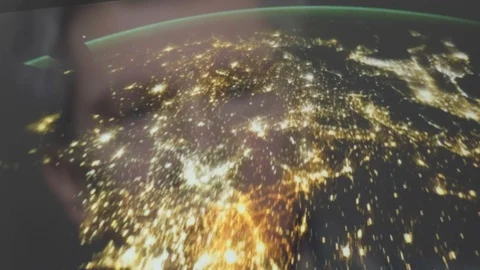Reflection of a man looking at a view of the earth from space Video stock 102605099