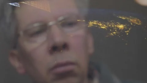 Reflection of a man looking at a view of the earth from space Video stock 102609988