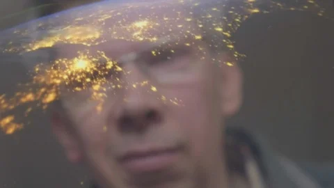 Reflection of a man looking at a view of the earth from space Video stock 102613523