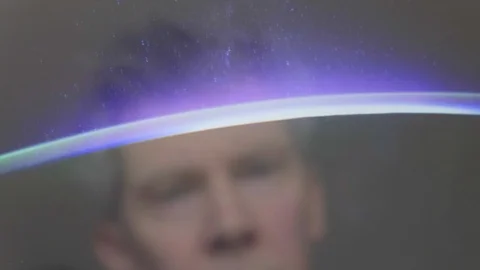 Reflection of a man looking at a view of the earth from space Video stock 102616991