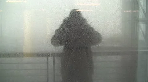 Reflection Of Man "Pointing And Waving" In Water Droplet Covered Window Video stock 19054621