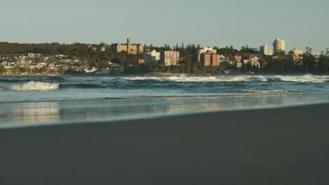 Reflection on Manly beach and Sydney architecture in distance slow motion Stock Footage 292377002