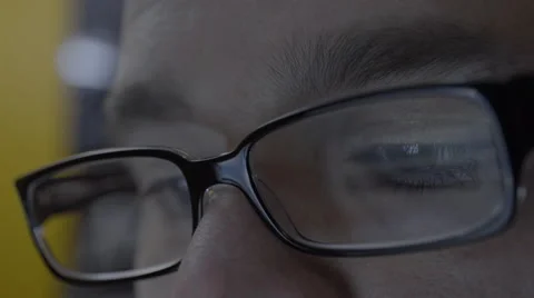 Reflection on mans eyeglasses. 4K UHD Stock-Footage 49585912