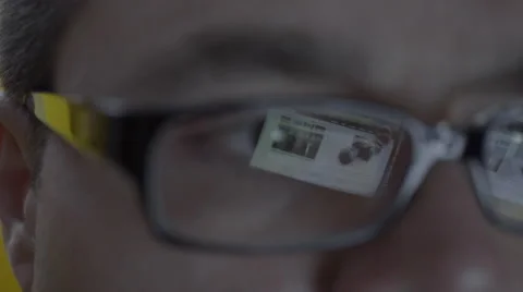 Reflection on mans eyeglasses. 4K UHD Stock Footage 49586357