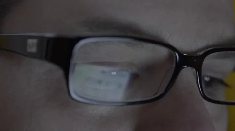 Reflection on mans eyeglasses. 4K UHD Stock Footage 49587043