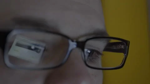 Reflection on mans eyeglasses. 4K UHD Stock Footage 49588219