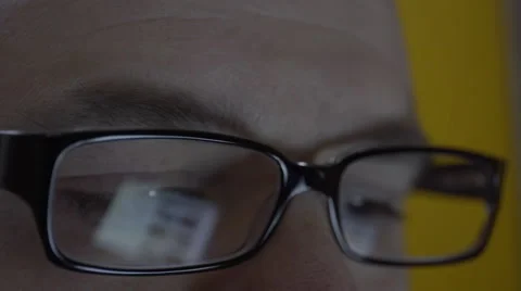 Reflection on mans eyeglasses. 4K UHD Stock-Footage 49590244