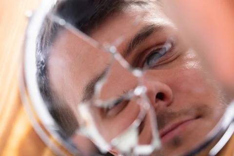 Reflection Of A Man's Face In Broken Mirror Stock Photos