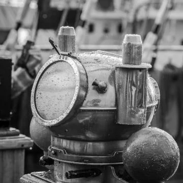 Reflection of a mast in an old ship compass, closeup. Black and white photo Stock Photos