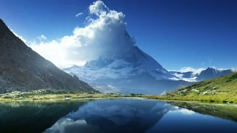 Reflection of Matterhorn in lake Riffelsee, Zermatt, Switzerland Stock Footage 84564853