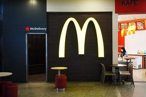 Reflection of McDonald's Logo and name on the floor 스톡 사진