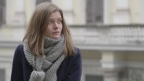 Reflection of Melancholy: Young Woman in Thought Video stock 260498341